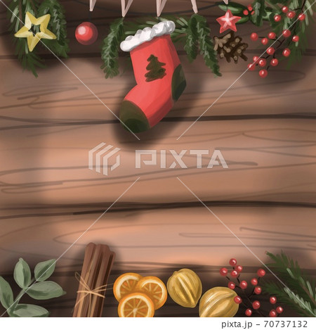 New year/Christmas blank postcard. On a wooden table background: gift sock, orange slices, cinnamon, nuts, cranberries and toys. 70737132