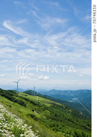 Beautiful mountain landscape, blue sky over hillside meadow 022 70746350