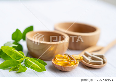 Alternative medicine herbal organic capsule with vitamin E omega 3 fish oil, mineral, drug with herbs leaf natural supplements for healthy good life. Alternative medicine herbal organic capsule with vitamin E omega 3 fish oil, mineral, drug with herbs leaf natural supplements for healthy good life. 70758953
