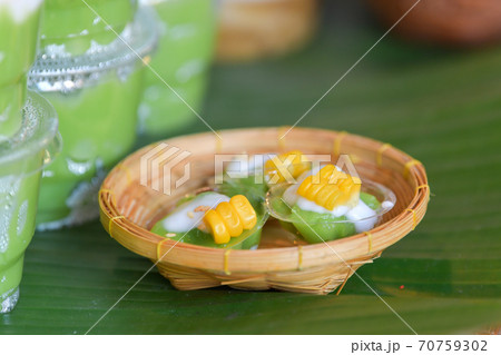 Green coconut sweet pudding and corn. Thai traditional dessert. Green coconut sweet pudding and corn. Thai traditional dessert. 70759302