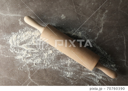 Rolling pin and flour on gray background, top view 70760390