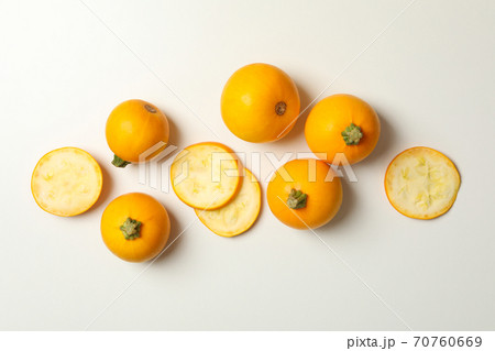 Round zucchini and slices on white background, top view 70760669