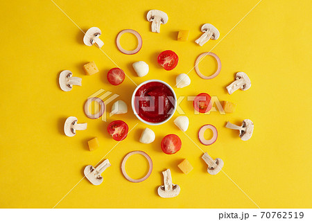 Ingredients for cooking pizza on yellow background 70762519