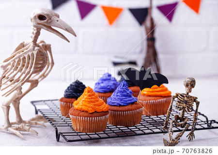Halloween cupcakes with color cream 70763826
