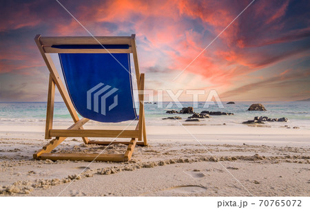 Amazing sunset watched from deck chair at white beach in Ko Lipe, Thailand Amazing sunset watched from deck chair at white beach in Ko Lipe, Thailand 70765072