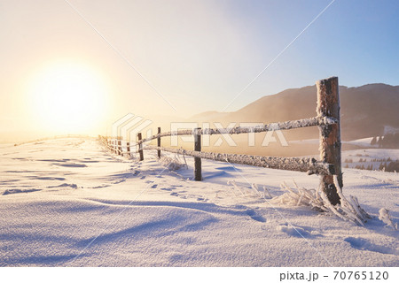 Mysterious winter landscape majestic mountains in winter. Magical winter snow covered tree. Photo greeting card. Carpathian. Ukraine Mysterious winter landscape majestic mountains in winter. Magical winter snow covered tree. Photo greeting card. Carpathian. Ukraine 70765120