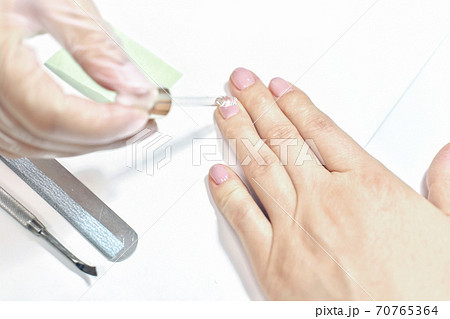 close up view of female hand and beautician close up view of female hand and beautician 70765364