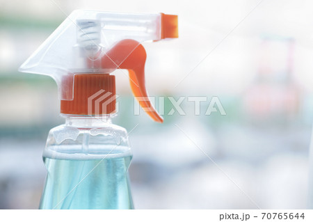sprayer with detergent cleaning product. Home cleaning and Housekeeping concept.  70765644