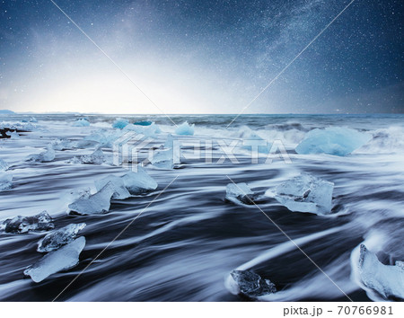 Icebergs floating in Jokulsarlon glacial lake. South Iceland. Lagoon. Starry sky night. Fantastic milky way. Icebergs floating in Jokulsarlon glacial lake. South Iceland. Lagoon. Starry sky night. Fantastic milky way. 70766981