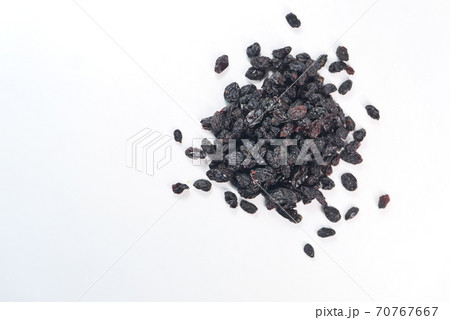 black raisin on white background, close up, 70767667