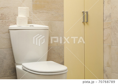 Toilet bowl in modern bathroom in light beige color Toilet bowl in modern bathroom in light beige color 70768789
