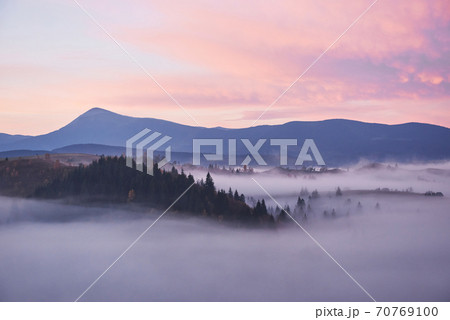 Foggy morning in the Ukrainian Carpathian Mountains in the autumn season Foggy morning in the Ukrainian Carpathian Mountains in the autumn season 70769100