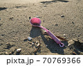 Plastic spoon kids toy discarded on dirty polluted sea ecosystem,planet pollution damage 70769366