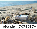 Dirty cigarette pack trash discarded on sea coast ecosystem,environmental pollution issues 70769370