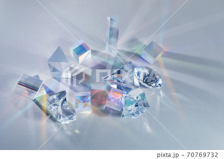 Crystal refracting light in rainbow colors on cold background. 70769732