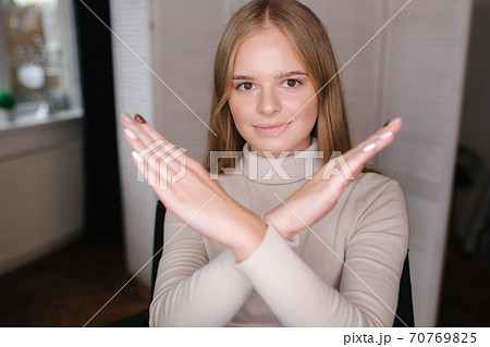 Beautiful blond hair woman crossed arms. Woman in beauty studio Beautiful blond hair woman crossed arms. Woman in beauty studio 70769825