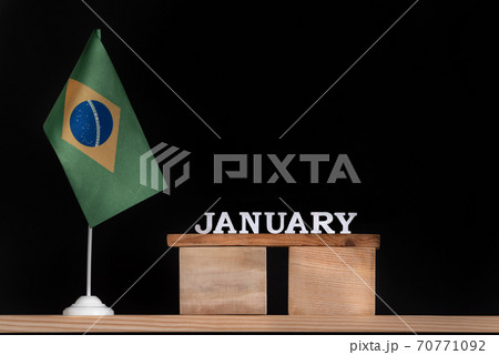 Wooden calendar of January with Brazilian flag on black background. Dates of Brazil in January Wooden calendar of January with Brazilian flag on black background. Dates of Brazil in January 70771092