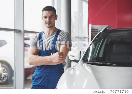 Hand of car mechanic with wrench. Auto repair garage Hand of car mechanic with wrench. Auto repair garage 70771716