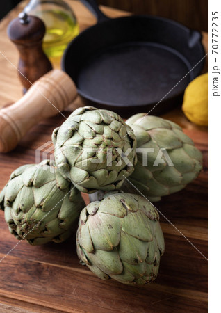artichoke on wooden board at kitchen 70772235