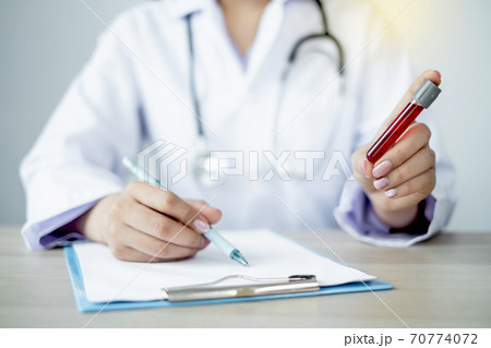 The picture of doctor's hand holding blood tube coronavirus test 70774072