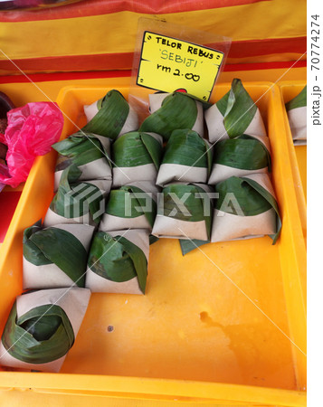 Nasi lemak. Is a signature food in Malaysia. Often eaten as breakfast. Nasi lemak is usually served with sambal, eggs and anchovies. Nasi lemak. Is a signature food in Malaysia. Often eaten as breakfast. Nasi lemak is usually served with sambal, eggs and anchovies. 70774274