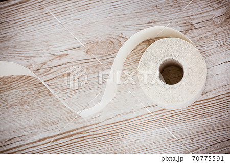 A large white toilet paper roll for use in bathrooms or kitchens, used for cleaning dirt in the bathroom background. 70775591