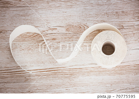 A large white toilet paper roll for use in bathrooms or kitchens, used for cleaning dirt in the bathroom background. 70775595