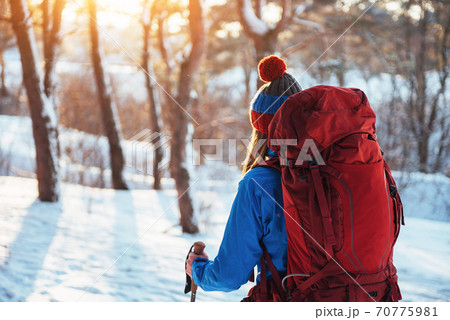 Woman Traveler with backpack hiking Travel Lifestyle adventure concept active vacations outdoor. Beautiful landscape forest Woman Traveler with backpack hiking Travel Lifestyle adventure concept active vacations outdoor. Beautiful landscape forest 70775981