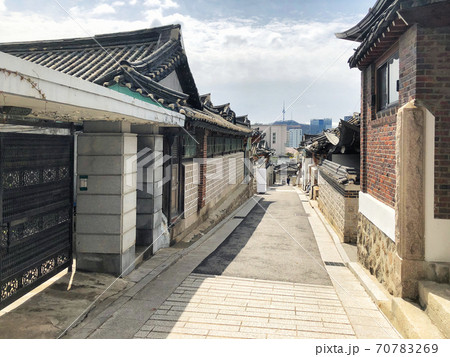 Bukchon Hanok Village And Seoul tower in daylight at Seoul, South Korea. Bukchon Hanok Village And Seoul tower in daylight at Seoul, South Korea. 70783269