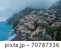 A high angle view of Positano with colorful buildings along the hillside. The morning atmosphere has fog over the city. 70787336