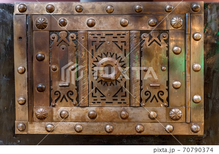 Close up of brass metal plate on chest cover Close up of brass metal plate on chest cover 70790374