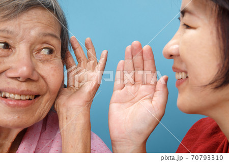 Asian seniors woman hearing loss , Hard of hearing try to talk with daughter. 70793310