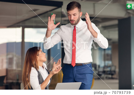 Happy Business people working together on computer 70793739