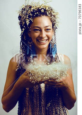 young pretty brunette girl with bouquet of little white spring flowers, lifestyle people concept 70796383