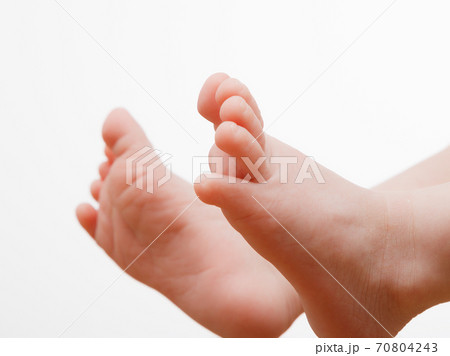 Little fingers. Legs newborn baby . Baby feet . Happy family concept. Beautiful conceptual image of motherhood Little fingers. Legs newborn baby . Baby feet . Happy family concept. Beautiful conceptual image of motherhood 70804243