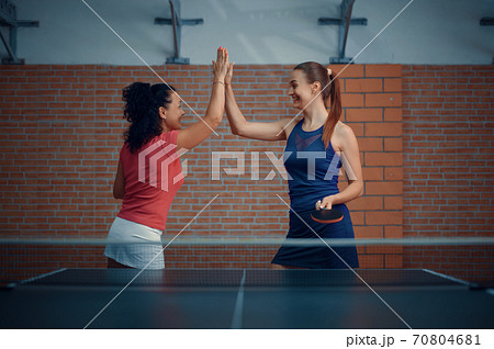 Women wins table tennis match, ping pong players Women wins table tennis match, ping pong players 70804681