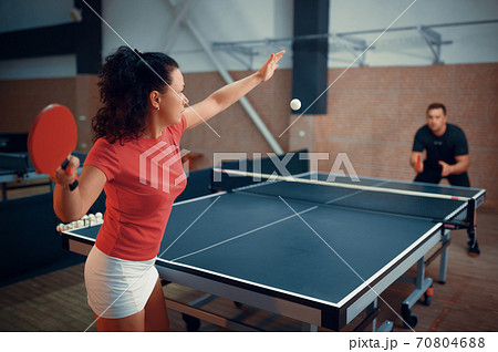 Woman hits the ball, table tennis, ping pong 70804688