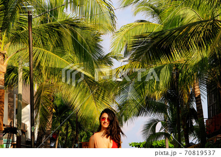 Woman at colorful street with palm trees in Sayulita, Nayarit, Mexico	 70819537