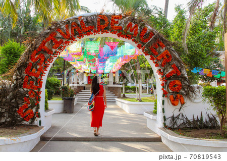 Woman at colorful street with palm trees in Sayulita, Nayarit, Mexico	 70819543
