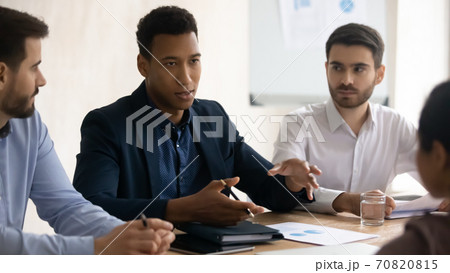 Motivated diverse colleagues brainstorm at meeting in office 70820815