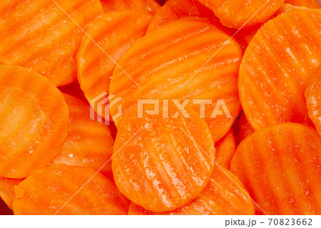 Top view of frozen sliced carrots close up Top view of frozen sliced carrots close up 70823662