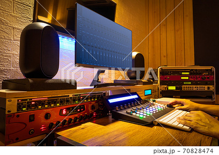 sound engineer hands working on digital professional audio equipment in recording, editing, broadcasting studio 70828474