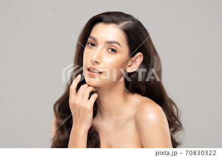 Beautiful Glamour indian woman touch chin smile with clean and fresh skin Happiness and cheerful with positive emotional,isolated on grey background,Beauty Cosmetics and spa Facial treatment Concept 70830322