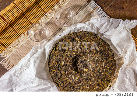 Shen Puerh, Traditional Chinese Tea, for copy space. the Chinese dry the tea. the view from the top Shen Puerh, Traditional Chinese Tea, for copy space. the Chinese dry the tea. the view from the top 70832131