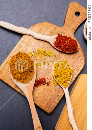 seasonings and spices on a stone black background. The view from the top. flat lay. vertical photo 70832309