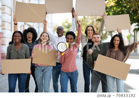 Black motivated lady leading group of strikers 70833192