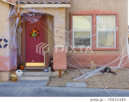 Sunny view of a beautiful Halloween decoration house 70833384