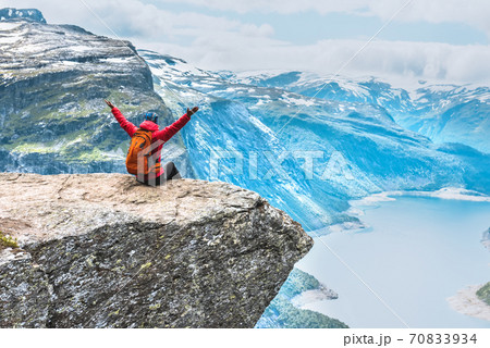Sporty woman posing on Trolltunga Norway Sporty woman posing on Trolltunga Norway 70833934