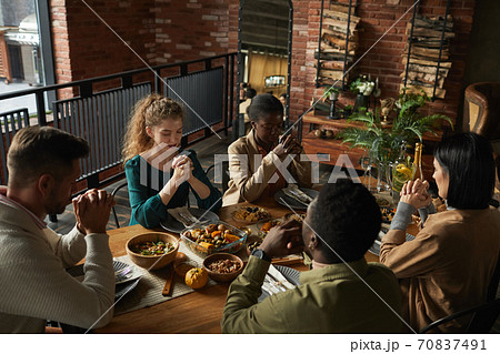 People Praying at Dinner Party People Praying at Dinner Party 70837491