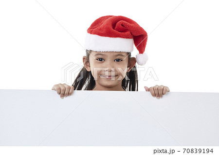 Happy little girl holding a blank board Happy little girl holding a blank board 70839194
